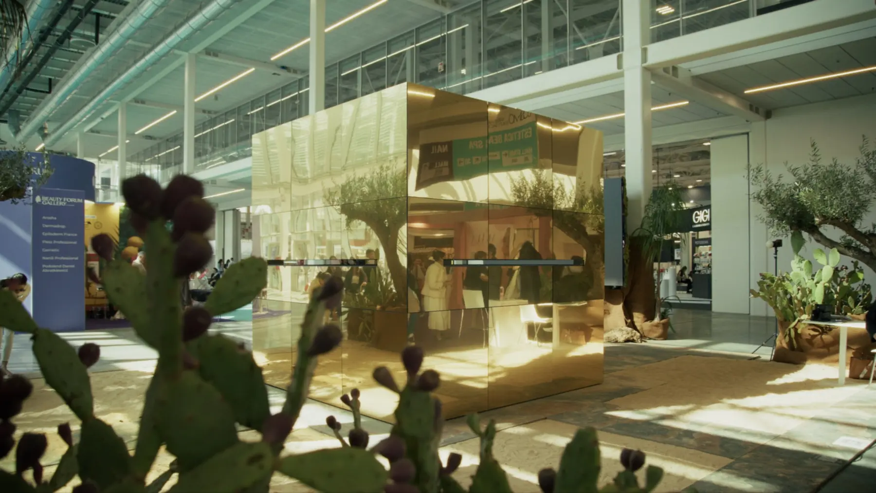 Concept rendering of a luminous cube installation in a beauty-event environment.